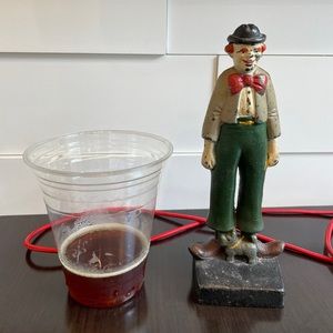 Solid cast iron clown w dog